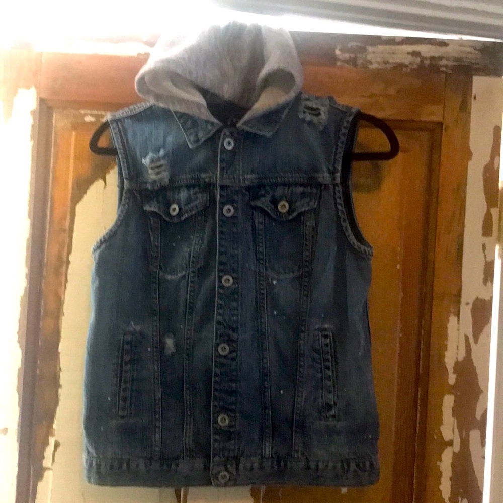 Distressed sleeveless hooded denim vest.